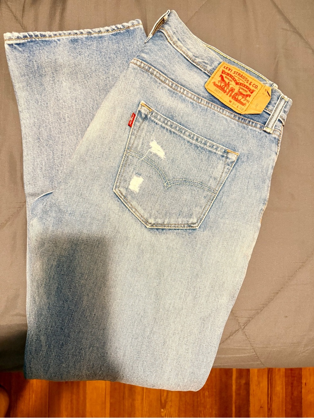Levi's 501 Button Fly Men's Light Wash Straight Jeans with Back Pocket Detail